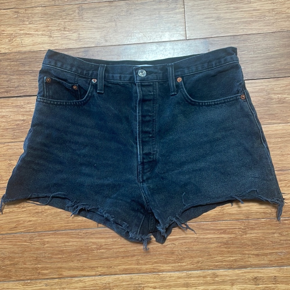 RE/DONE jeans in color broken black. Cut into shorts.